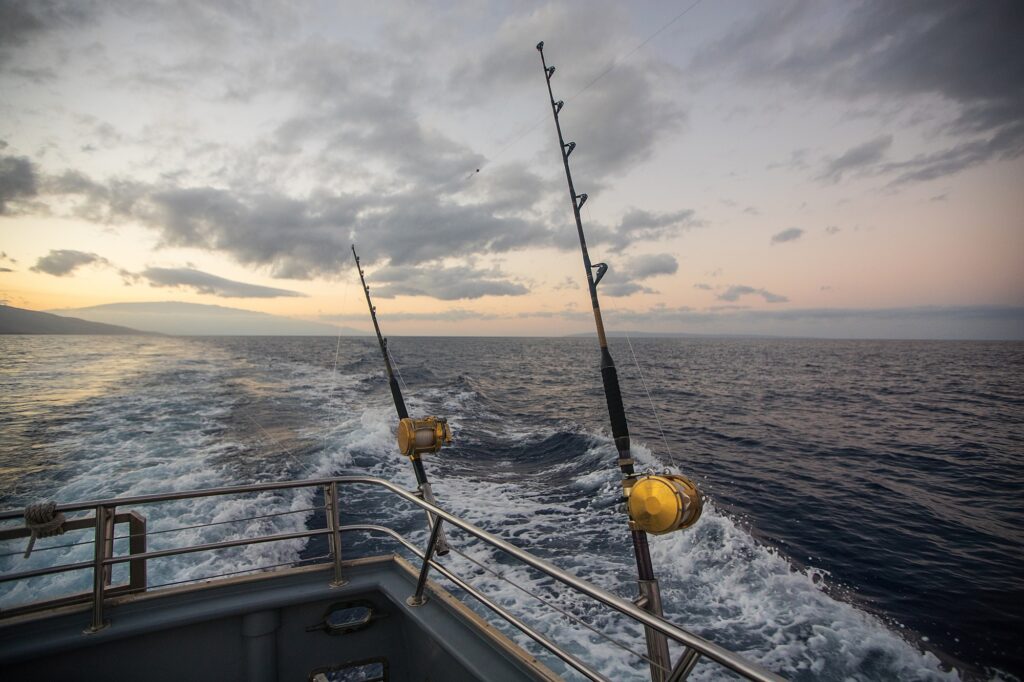 Deep Sea Fishing Reel on a boat during sunrise