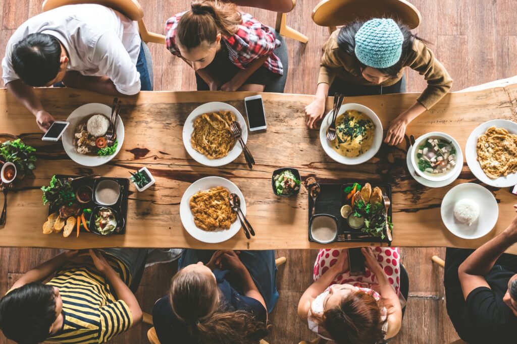 Top view of Family gathering together at home for eating dinner.